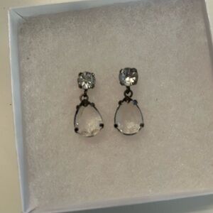Clear crystal-style teardrop dangle earrings with round rhinestone studs.